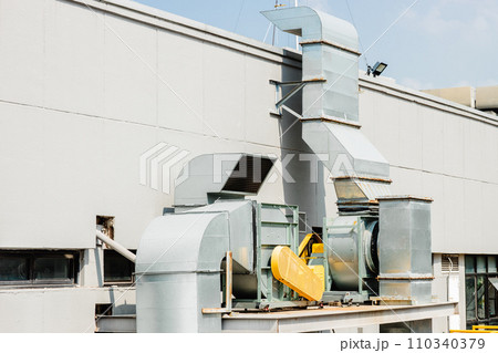 Air ventilator system in large commercial building, Air flow ventilate fan machine with smoke filter duct outside roof building. 110340379