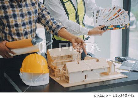 Construction and structure concept of Engineer or architect meeting for project working with partner and engineering tools on model building and blueprint in working site, contract for both companies. Construction and structure concept of Engineer or architect meeting for project working with partner and engineering tools on model building and blueprint in working site, contract for both companies. 110340745