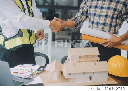 Construction and structure concept of Engineer or architect meeting for project working with partner and engineering tools on model building and blueprint in working site, contract for both companies. Construction and structure concept of Engineer or architect meeting for project working with partner and engineering tools on model building and blueprint in working site, contract for both companies. 110340746
