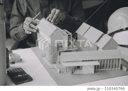 Construction and structure concept of Engineer or architect meeting for project working with partner and engineering tools on model building and blueprint in working site, contract for both companies. Construction and structure concept of Engineer or architect meeting for project working with partner and engineering tools on model building and blueprint in working site, contract for both companies. 110340760