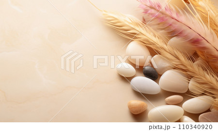 AI-generated content. Delicate peach background with decorative stones and feathers. 110340920