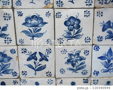 Blue ceramic tiles from wall at Monte palace tropical garden at Funchal Madeira. Portuguese traditional Azulejos decorative artistic design background, creative texture surface Blue ceramic tiles from wall at Monte palace tropical garden at Funchal Madeira. Portuguese traditional Azulejos decorative artistic design background, creative texture surface 110340949