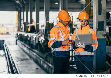 Engineer safety officer team man and women working together with laptop checking inspect in heavy industry building factory. Engineer safety officer team man and women working together with laptop checking inspect in heavy industry building factory. 110341302