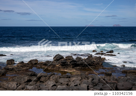 Volcanic rocks on the coast, Lanzarote, Spain 110342156