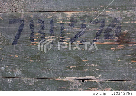 Green wood texture background from army ammunition wooden crate with abstract number. Green wood texture background from army ammunition wooden crate with abstract number. 110345765