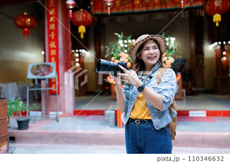 Young Asian woman backpack traveler using a camera. Journey trip lifestyle. travel concept 110346632