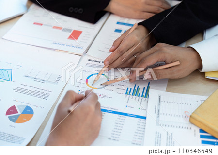 analyst team is doing teamwork and brainstorming about new strategy project at the meeting room. 110346649