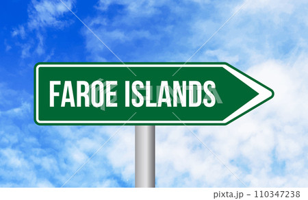 Faroe islands road sign on blue sky background 110347238