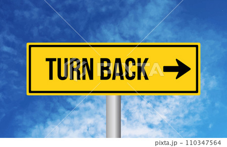 Turn back road sign on cloudy sky background 110347564