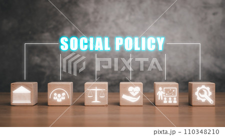 Social policy concept, Wooden block on desk with social policy icon on virtual screen. Social policy concept, Wooden block on desk with social policy icon on virtual screen. 110348210