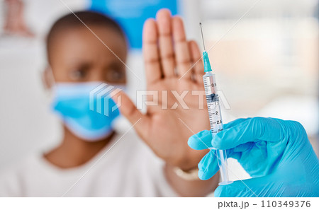 Vaccine hesitancy, covid and female patient stopping doctor from giving the injection at the clinic. Woman refusing to take the vaccination while a healthcare worker prepares the needle and syringe. Vaccine hesitancy, covid and female patient stopping doctor from giving the injection at the clinic. Woman refusing to take the vaccination while a healthcare worker prepares the needle and syringe. 110349376