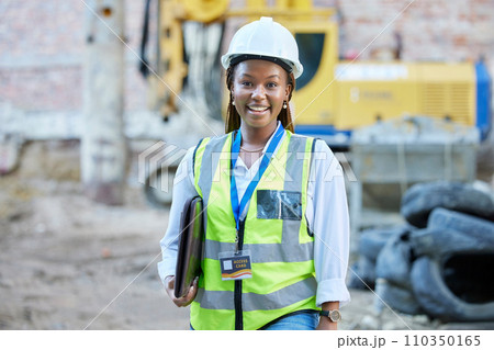 Happy engineer, construction worker or architect woman feeling proud and satisfied with career opportunity. Portrait of black building management employee or manager working on a project site 110350165