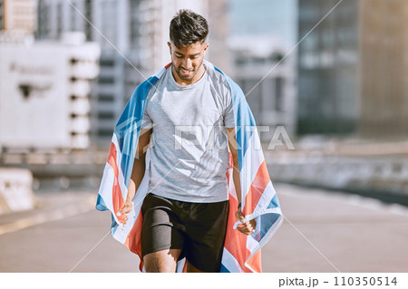 Fitness, training and workout with a sports man in a british flag running a marathon in the city. Health, exercise and wellness with an olympic athlete or runner exercising for cardio and endurance Fitness, training and workout with a sports man in a british flag running a marathon in the city. Health, exercise and wellness with an olympic athlete or runner exercising for cardio and endurance 110350514