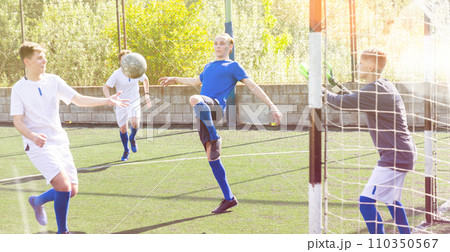 Young football players fighting for ball 110350567