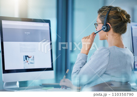 CRM call center agent talking using wireless headset, consulting client online, giving feedback, working on computer. Helpdesk hotline support operator browsing internet doing customer service work. CRM call center agent talking using wireless headset, consulting client online, giving feedback, working on computer. Helpdesk hotline support operator browsing internet doing customer service work. 110350790