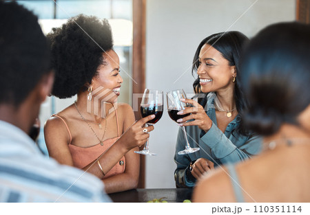 Friends having fun and drinking wine, toasting, bonding and celebrating at an event or party. Diverse friends cheers and laughing, enjoying free time, dining experience and wine tasting gathering 110351114
