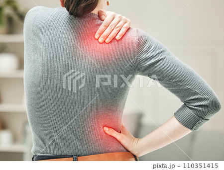 Shoulder, hip and back pain of a woman touching and holding a painful area on her body in red. Closeup of a female feeling strain, ache and discomfort from a glowing muscle injury problem. 110351415