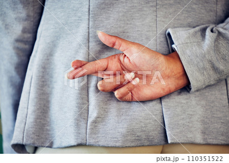 Hand gesture, sign or icon of a liar not telling the truth and being dishonest. Female waiting for good news and holding a sign. Woman crossing fingers for good luck, hope or a lie, behind her back. Hand gesture, sign or icon of a liar not telling the truth and being dishonest. Female waiting for good news and holding a sign. Woman crossing fingers for good luck, hope or a lie, behind her back. 110351522