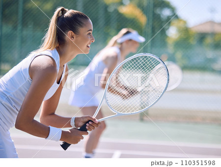 Female tennis player or sports woman with racket and sports gear playing a match outdoors sport court. Fit young girl enjoying hobby, exercising or competitive activity with equipment or sporty gear Female tennis player or sports woman with racket and sports gear playing a match outdoors sport court. Fit young girl enjoying hobby, exercising or competitive activity with equipment or sporty gear 110351598