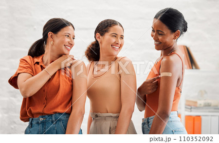 Antiviral immunity, covid vaccine and showing arms with band aid plaster after an injection in a clinic. Diverse women recommend booster jab for protection from coronavirus, sickness and disease 110352092