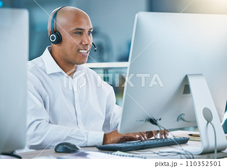 Professional, friendly customer service or sales consultant agency worker working with headset and desktop. Smiling male employee consulting with a client at call center or contact us helpdesk Professional, friendly customer service or sales consultant agency worker working with headset and desktop. Smiling male employee consulting with a client at call center or contact us helpdesk 110352501
