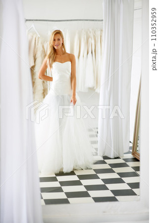 Wedding, dress and portrait of young bride in a luxury boutique, shop or store in a mall. Retail, style and female person from Canada preparing for marriage ceremony, party or reception for love. Wedding, dress and portrait of young bride in a luxury boutique, shop or store in a mall. Retail, style and female person from Canada preparing for marriage ceremony, party or reception for love. 110352959