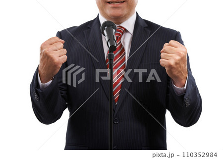 Microphone, speaker and hands of business man on a white background for presentation, speech and seminar. Debate, public speaking and politician for conference, convention and talking in studio 110352984