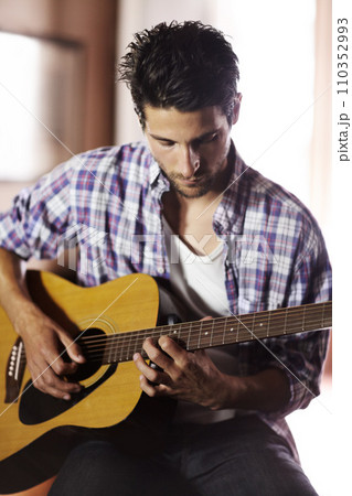 Guitar, play and man in recording studio with musician writing music with creativity. Artist, talent and skill with playing a notes on instrument, strings and creative sound in jazz or songwriting 110352993