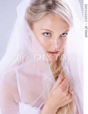Beauty, bride and woman with a veil, wedding ring and commitment on a white studio background. Person, girl and model with a gown, marriage and love with fashion, event and lingerie with makeup Beauty, bride and woman with a veil, wedding ring and commitment on a white studio background. Person, girl and model with a gown, marriage and love with fashion, event and lingerie with makeup 110353102
