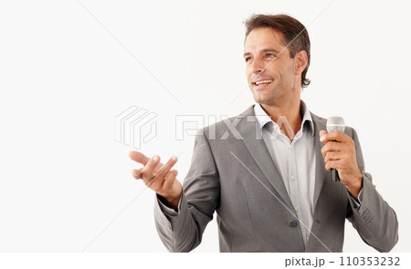Man, microphone and smile in speech, studio and motivational or public speaker, tv and white background. Happy mature person, broadcast and feedback or voice, anchor and media or influencer in mockup 110353232