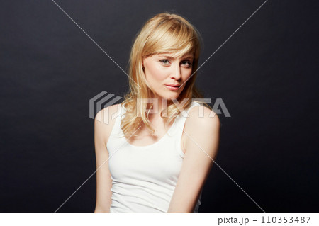 Woman, portrait and beauty with hair and cosmetic care for shine and salon treatment on dark background. Young model from Sweden in studio, healthy texture and haircare for growth with glow 110353487