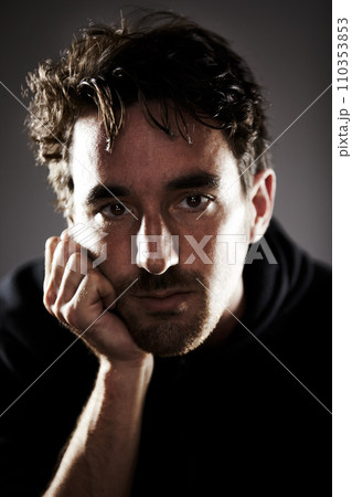 Man, depression and portrait, sad with mental health and crisis in studio, feelings and grief on grey background. Pain, wellness and depressed, trauma or abuse, distress and upset with psychology 110353853