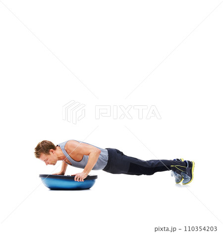 Man, exercise and push ups with bosu ball for fitness, workout or training on a white studio background. Active male person lifting body weight for strength, muscle or strong arms on mockup space Man, exercise and push ups with bosu ball for fitness, workout or training on a white studio background. Active male person lifting body weight for strength, muscle or strong arms on mockup space 110354203