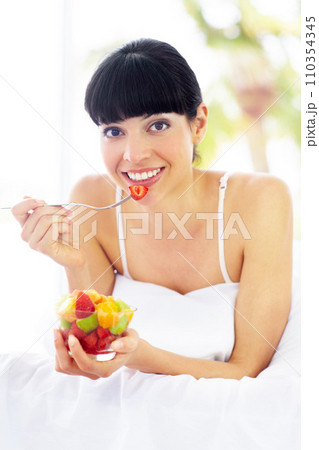 Fruit salad, home bed and portrait of happy woman with organic meal, snack or morning breakfast for healthy lifestyle balance. Apartment bedroom, strawberry benefits or relax person eating vegan food Fruit salad, home bed and portrait of happy woman with organic meal, snack or morning breakfast for healthy lifestyle balance. Apartment bedroom, strawberry benefits or relax person eating vegan food 110354345
