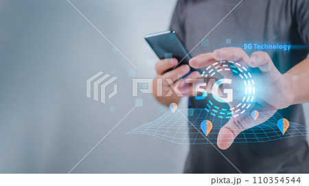 Close-up of human hand holding smartphone and pointing at 5G hologram, 5G wireless network system, 5G network concept, High speed mobile internet, New era connection network Close-up of human hand holding smartphone and pointing at 5G hologram, 5G wireless network system, 5G network concept, High speed mobile internet, New era connection network 110354544
