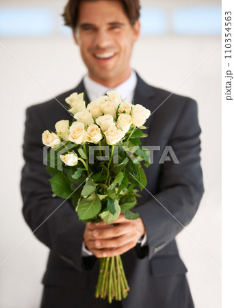 Gift, portrait and happy man with flowers for love, giving or valentines day celebration on wall background. Face, roses and person with bouquet for anniversary, romance or congratulations gesture Gift, portrait and happy man with flowers for love, giving or valentines day celebration on wall background. Face, roses and person with bouquet for anniversary, romance or congratulations gesture 110354563
