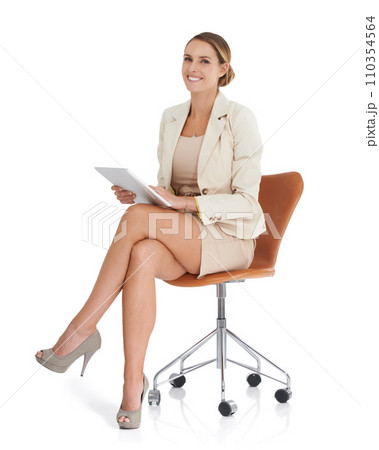 Business woman, tablet and chair in studio for online planning, research and human resources management. Portrait of professional employee on digital technology or software on a white background 110354564