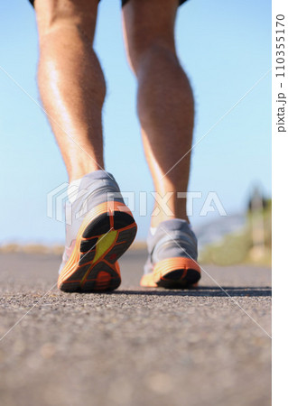 Man, shoes and legs running on road for fitness, workout or outdoor exercise on asphalt. Closeup of male person or athlete on street with sneakers for run, cardio or floor grip in health and wellness 110355170