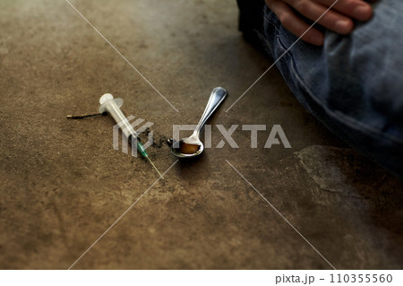 Person, syringe as drugs on spoon liquid closeup as high substance, illegal addiction or abuse. Meth, narcotic or danger vice problem injection for junkie bad habit, stress relief from mental health Person, syringe as drugs on spoon liquid closeup as high substance, illegal addiction or abuse. Meth, narcotic or danger vice problem injection for junkie bad habit, stress relief from mental health 110355560