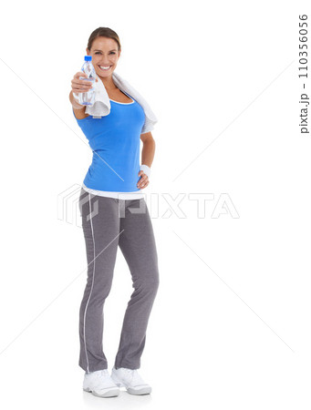Woman, training and water bottle in studio for health, wellness and fitness on a white background. Portrait of happy person or sports model with towel and liquid offer for energy, workout or exercise 110356056