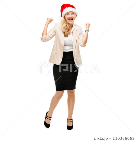 Celebrating business achievements no matter the day. a senior businesswoman wearing a christmas hat cheering against a studio background. Celebrating business achievements no matter the day. a senior businesswoman wearing a christmas hat cheering against a studio background. 110356065