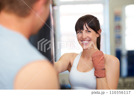 Happy woman, portrait and boxing with personal trainer for self defense, workout or exercise at gym. Face of female person or boxer smile for MMA, fighting or indoor training in martial arts practice 110356117