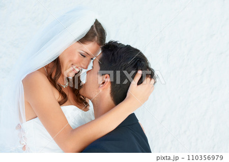 Love, woman and man embrace at wedding with smile, touch and commitment for couple at reception. Romance, bride and groom hugging at marriage celebration with happiness, loyalty and future together. 110356979
