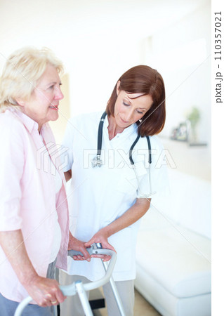 With every step comes progress - Senior Care. Mature nurse assists her senior female patient as she uses her zimmer frame. With every step comes progress - Senior Care. Mature nurse assists her senior female patient as she uses her zimmer frame. 110357021