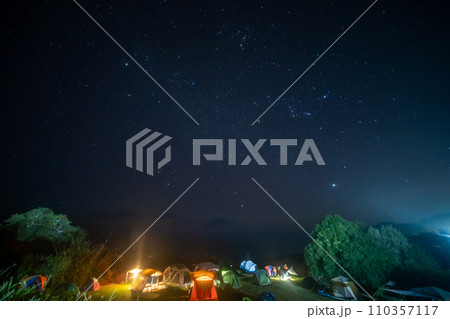 travel and people activity concept with star in the night with camping tent 110357117