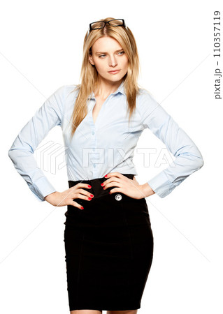 Welcome to the world of business. a beautiful young businesswoman against a studio background. 110357119