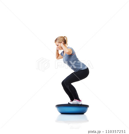 Woman, profile and squat with workout, ball or balance for legs, muscle development or studio by white background. Person, exercise and training for strong healthy body for vision, wellness or health 110357251
