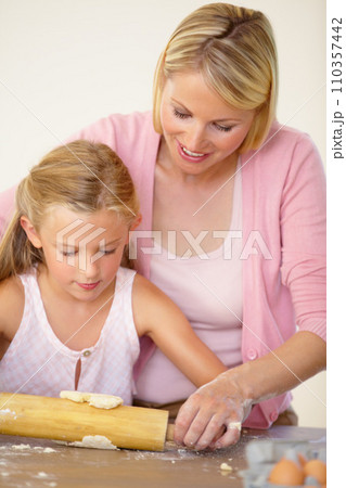 Dough, rolling pin or baking family, child and mom teaching youth, daughter or girl to prepare dessert, food or recipe. Kitchen, support or young kid learning home cooking together with mother Dough, rolling pin or baking family, child and mom teaching youth, daughter or girl to prepare dessert, food or recipe. Kitchen, support or young kid learning home cooking together with mother 110357442