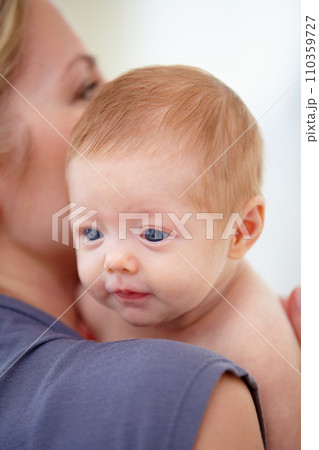 Family, shoulder and mom with baby in home for bonding, loving relationship and affection. Love, bedroom and closeup of mother carrying newborn for child development, growth and care in nursery 110359727