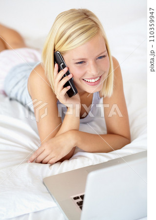 Relax, laptop and phone call with woman on bedroom for contact, communication and connection. Happy, digital and technology with female person in home for calm, listening and mobile conversation Relax, laptop and phone call with woman on bedroom for contact, communication and connection. Happy, digital and technology with female person in home for calm, listening and mobile conversation 110359947